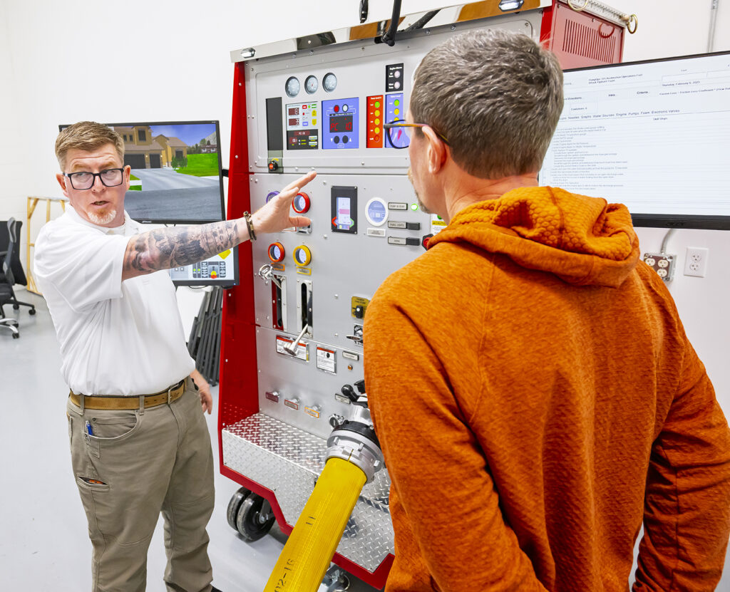 Firefighting Instructor Demonstrating Controls to Trainee